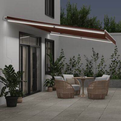 vidaXL Toldo retráctil manual con luces LED marrón 600x350 cm