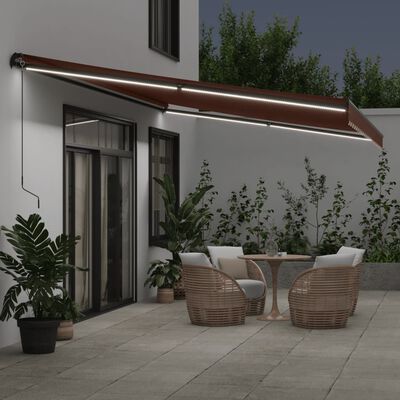 vidaXL Toldo retráctil manual con luces LED marrón 500x350 cm