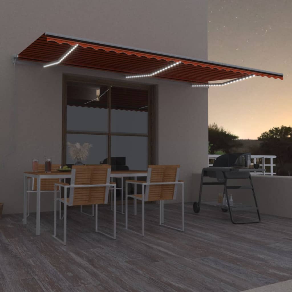 vidaXL Toldo manual retráctil con LED naranja y marrón 600x350 cm